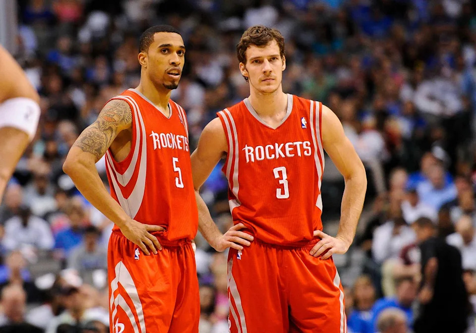 Apr 18, 2012; Dallas, TX, USA; Houston Rockets shooting guard Courtney Lee (5) and point guard Goran Dragic (3) wait for play to resume during the game against the Dallas Mavericks at the American Airlines Center. The Mavericks defeated the Rockets 117-110. Mandatory Credit: Jerome Miron-USA TODAY Sports