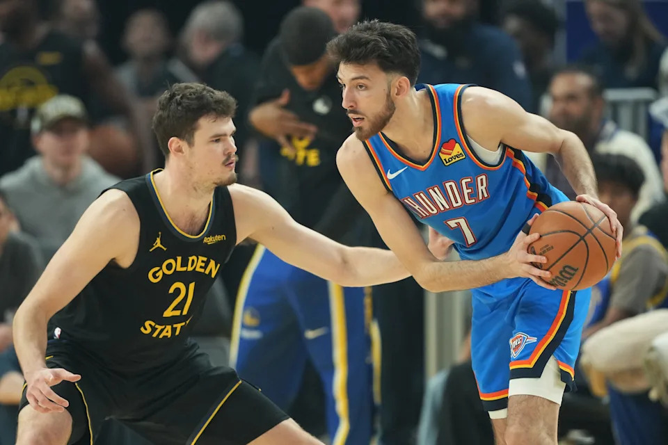 Jan 2, 2026; San Francisco, California, USA; Oklahoma City Thunder center Chet Holmgren (7) handles the ball against Golden State Warriors center Quinten Post (21) during the first quarter at Chase Center. Mandatory Credit: Darren Yamashita-Imagn Images