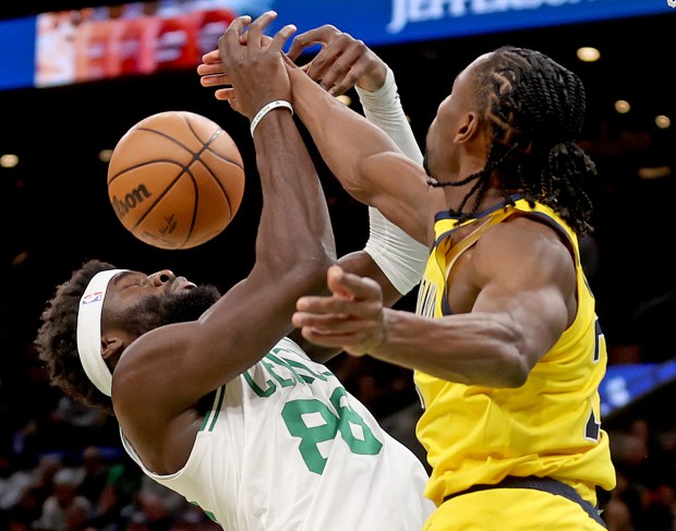 Boston Celtics center Neemias Queta (88) and Indiana Pacers guard Aaron Nesmith battle for a rebound during the first half Wednesday. (Photo By Matt Stone/Boston Herald)