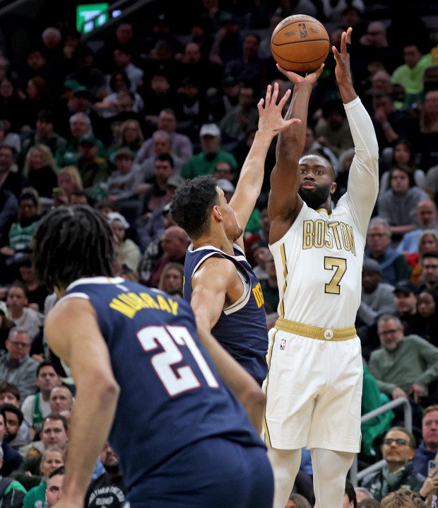 Boston Celtics guard Jaylen Brown (7) hits a 3-pointer against the Denver Nuggets during the first half at TD Garden. (Photo By Matt Stone/Boston Herald)