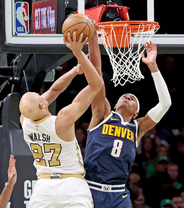 Denver Nuggets guard Peyton Watson (8) stops Boston Celtics guard Jordan Walsh (27) during the second half at TD Garden. (Photo By Matt Stone/Boston Herald)
