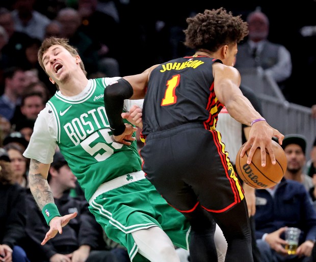 Atlanta Hawks forward Jalen Johnson (1) fouls Boston Celtics guard Baylor Scheierman during the second half Wednesday. (Photo By Matt Stone/Boston Herald)