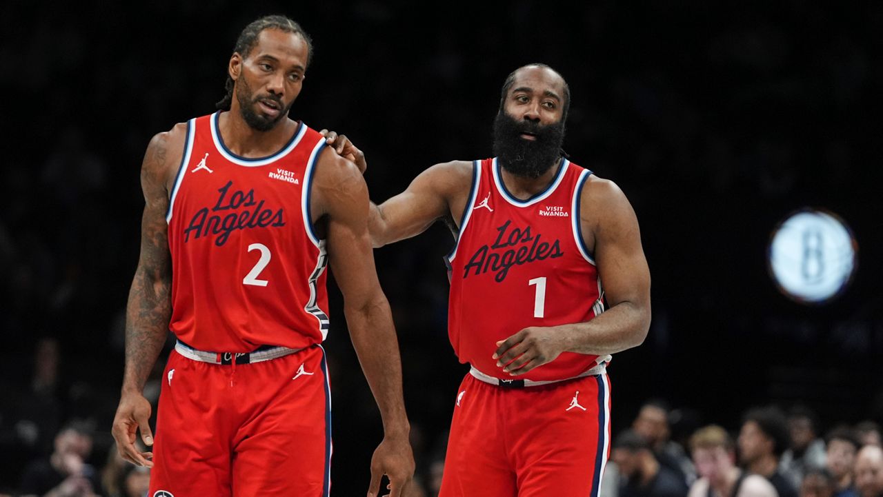LA Clippers' James Harden (1) talks to Kawhi Leonard (2) during the second half of an NBA basketball game against the Brooklyn Nets Friday, Jan. 9, 2026, in New York. (AP Photo/Frank Franklin II)