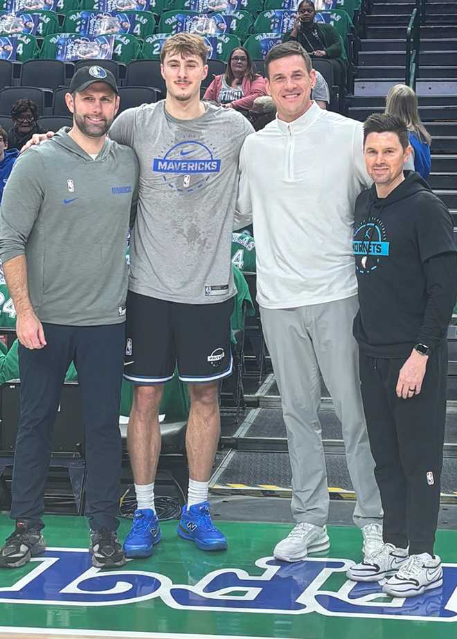Dallas Mavericks player Cooper Flagg (second from left) and his trainer, Matt MacKenzie (far left), posed for a photo with Charlotte Hornets professional scout Nik Caner-Medley (second from right) and Hornets assistant coach Josh Longstaff before the Mavericks played the Hornets in Dallas on Jan. 29, 2026. All four men are Maine natives.