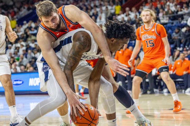 Illinois center Tomislav Ivišić, top, tries to get the ball away from Penn State forward Mason Blackwood on Saturday, Jan. 3, 2026, in Philadelphia. (AP Photo/Laurence Kesterson)