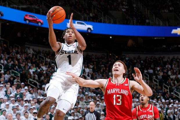 Michigan State guard Jeremy Fears Jr. goes up for a shot against Maryland forward Elijah Saunders on Saturday, Jan. 24, 2026, in East Lansing, Mich. (AP Photo/Al Goldis)