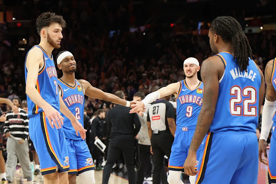 PHOENIX, ARIZONA - JANUARY 04: Shai Gilgeous-Alexander #2 and Alex Caruso #9 of the Oklahoma City Thunder react after being defeated by the Phoenix Suns in NBA game at Mortgage Matchup Center on January 04, 2026 in Phoenix, Arizona. The Suns defeated the Thunder 108-105. NOTE TO USER: User expressly acknowledges and agrees that, by downloading and or using this photograph, user is consenting to the terms and conditions of the Getty Images License Agreement. (Photo by Christian Petersen/Getty Images)
