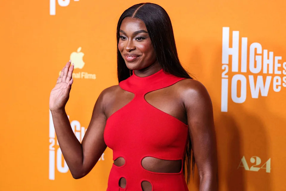 Coco Jones posing on the red carpet. 