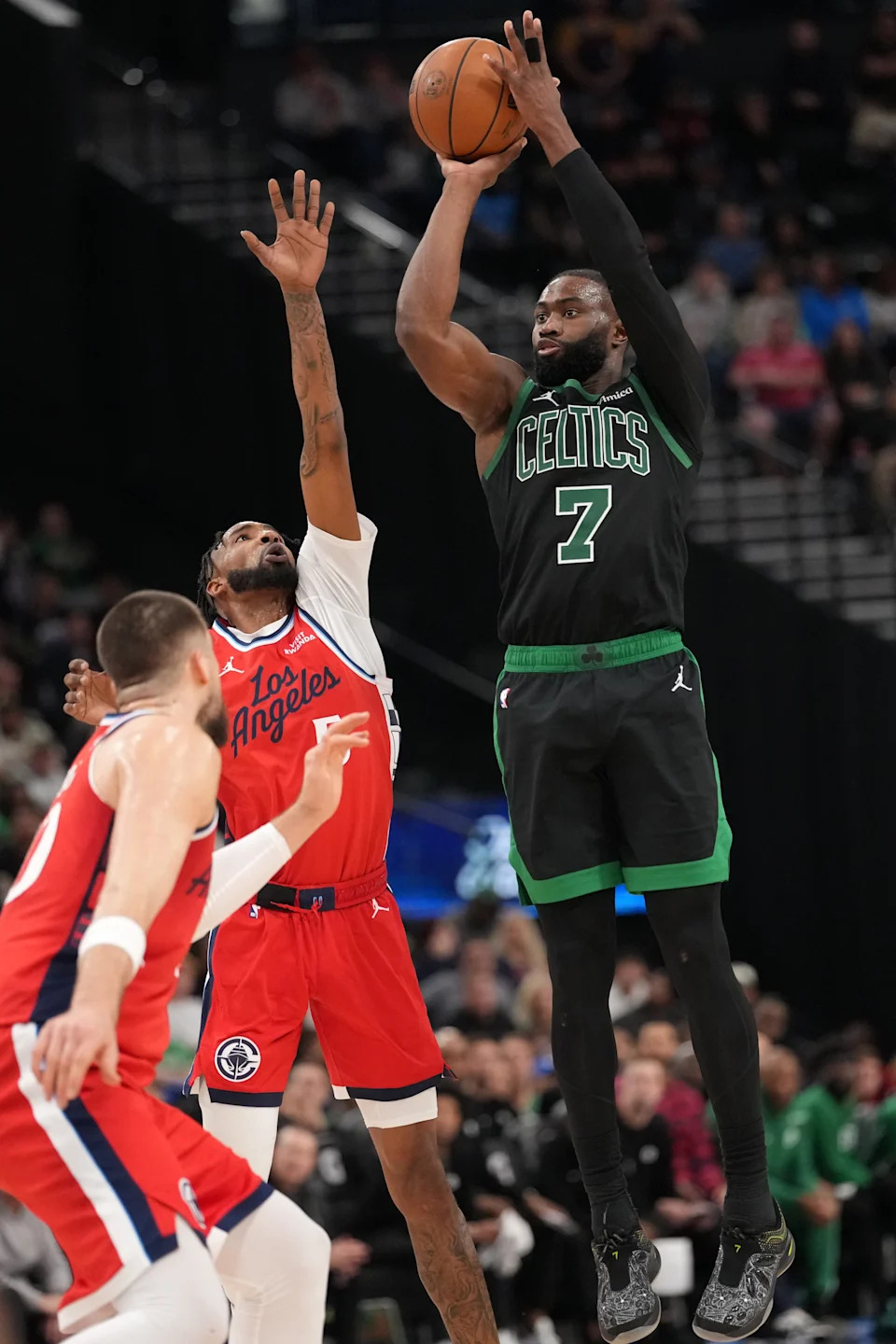 Jan 3, 2026; Inglewood, California, USA; Boston Celtics guard Jaylen Brown (7) shoots the ball against forward Derrick Jones Jr. (5) in the second half at Intuit Dome. Mandatory Credit: Kirby Lee-Imagn Images