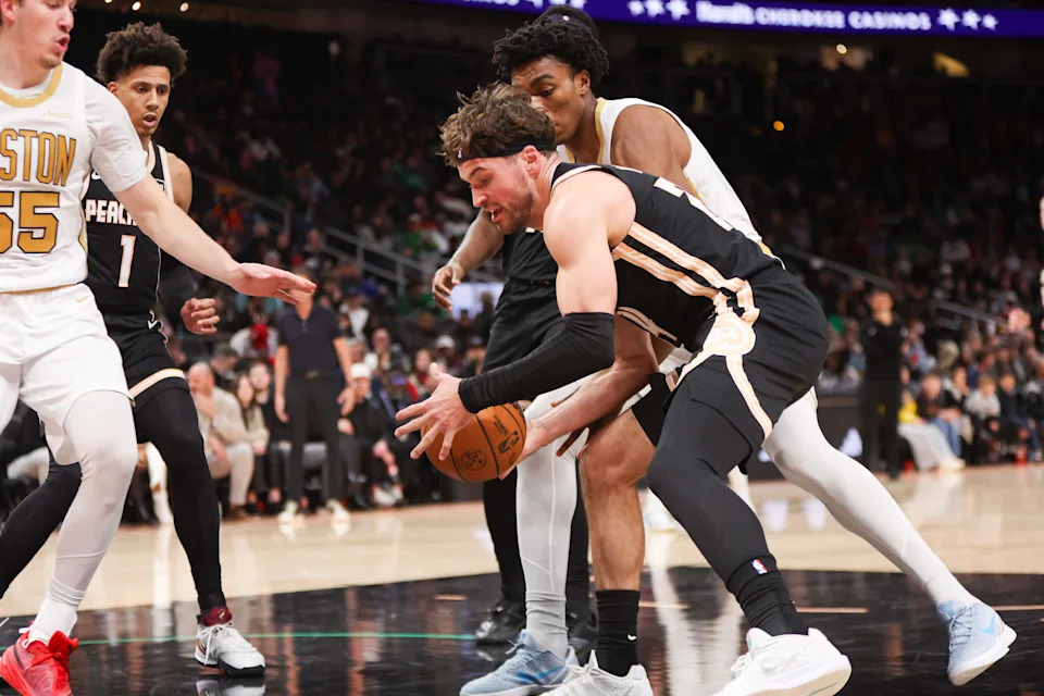 Jan 17, 2026; Atlanta, Georgia, USA; Atlanta Hawks forward Corey Kispert (24) grabs a loose ball against the Boston Celtics in the fourth quarter at State Farm Arena. Mandatory Credit: Brett Davis-Imagn Images