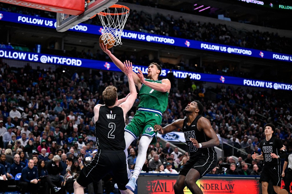 Dallas Mavericks forward Dwight Powell (7) makes a basket over Brooklyn Nets forward Danny Wolf (2).