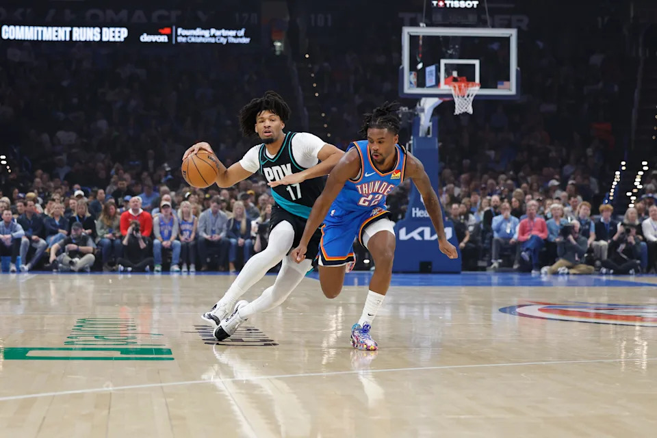 Dec 31, 2025; Oklahoma City, Oklahoma, USA; Portland Trail Blazers guard Shaedon Sharpe (17) dribbles down the court beside Oklahoma City Thunder guard Cason Wallace (22) during the first quarter at Paycom Center. Mandatory Credit: Alonzo Adams-Imagn Images