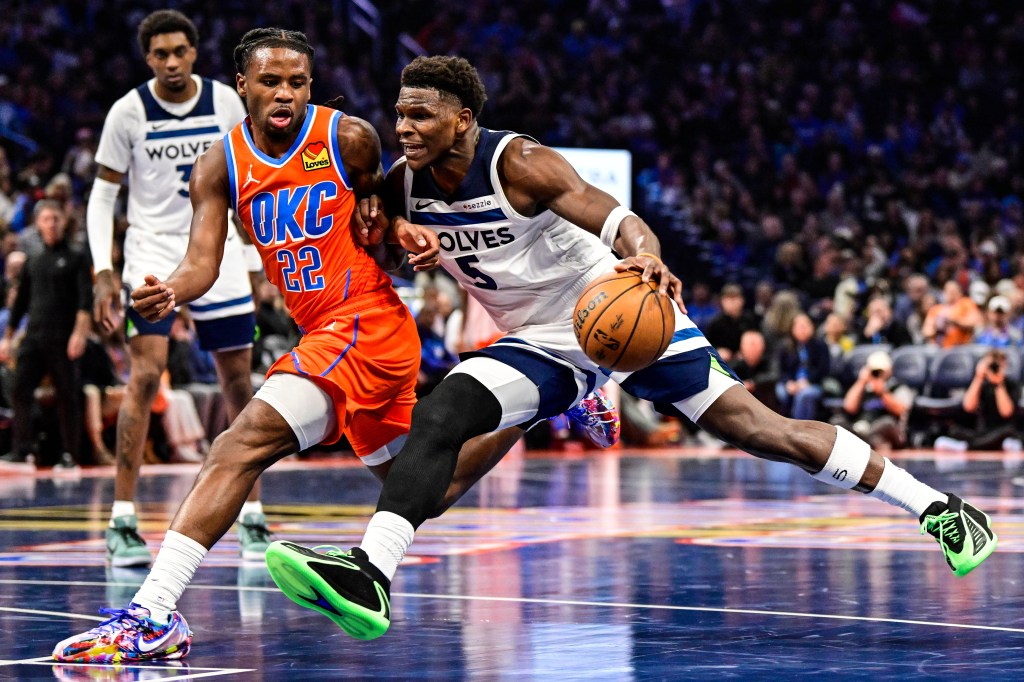 Minnesota Timberwolves guard Anthony Edwards (5) drives against Oklahoma City Thunder guard Cason Wallace (22).