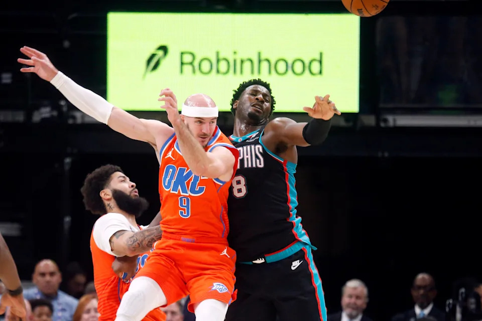 Jan 9, 2026; Memphis, Tennessee, USA; Oklahoma City Thunder guard Alex Caruso (9) and Memphis Grizzlies forward/center Jaren Jackson Jr. (8) battle for the ball during the second quarter at FedExForum. Mandatory Credit: Petre Thomas-Imagn Images