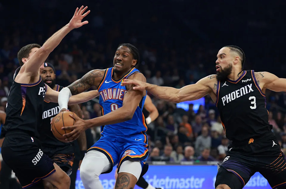 Jan 4, 2026; Phoenix, Arizona, USA; Phoenix Suns forward Dillon Brooks (3) defends against Oklahoma City Thunder guard Jalen Williams (8) in the first half at Mortgage Matchup Center. Mandatory Credit: Mark J. Rebilas-Imagn Images