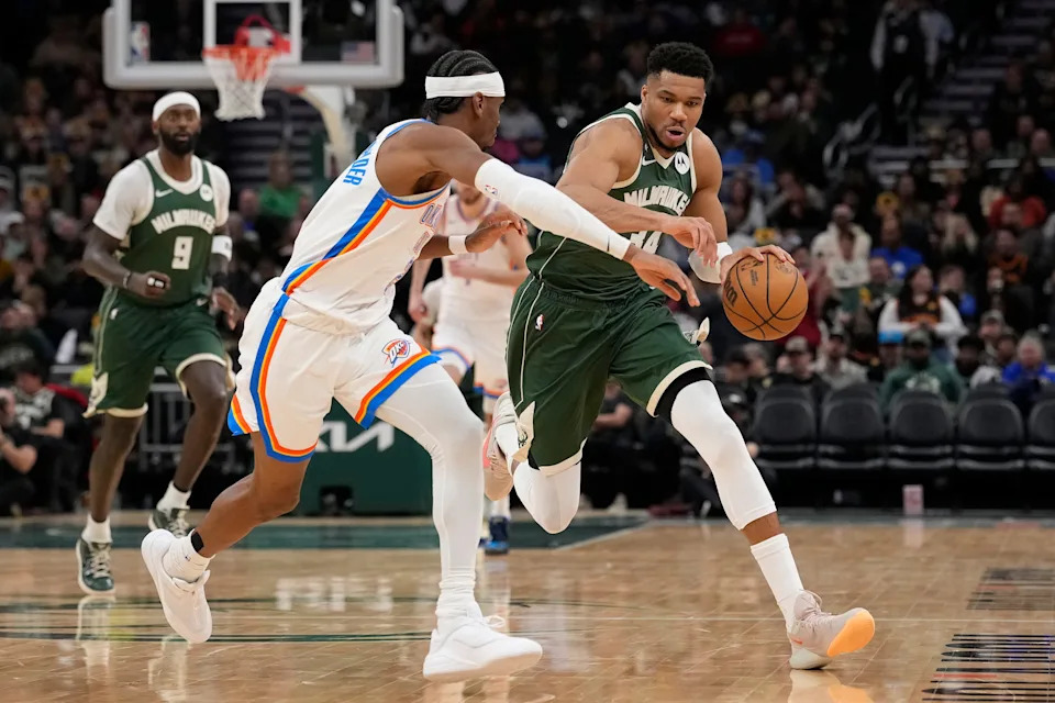 MILWAUKEE, WISCONSIN - JANUARY 21: Giannis Antetokounmpo #34 of the Milwaukee Bucks dribbles the ball against Shai Gilgeous-Alexander #2 of the Oklahoma City Thunder during the third quarter at Fiserv Forum on January 21, 2026 in Milwaukee, Wisconsin. NOTE TO USER: User expressly acknowledges and agrees that, by downloading and or using this photograph, User is consenting to the terms and conditions of the Getty Images License Agreement. (Photo by Patrick McDermott/Getty Images)