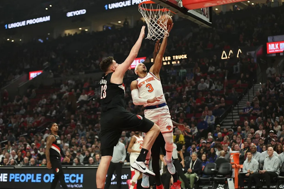 Knicks guard Josh Hart (3) drives to the basket as Portland Trail Blazers center Donovan Clingan (23) defends during the first half of an NBA basketball game Sunday, Jan. 11, 2026, in Portland, Ore. AP