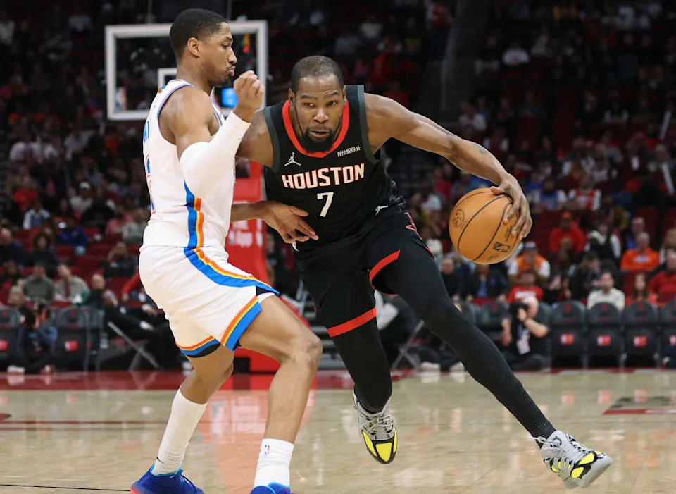 Jan 15, 2026; Houston, Texas, USA; Houston Rockets forward Kevin Durant (7) dribbles the ball as Oklahoma City Thunder guard Aaron Wiggins (21) defends during the first quarter at Toyota Center. Mandatory Credit: Troy Taormina-Imagn Images
