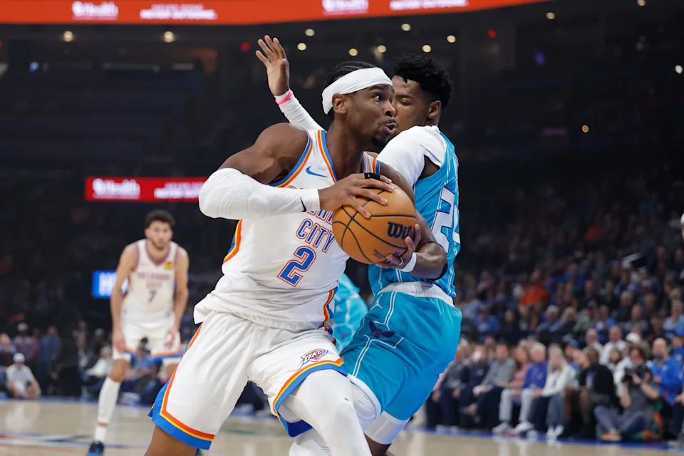 Jan 5, 2026; Oklahoma City, Oklahoma, USA; Oklahoma City Thunder guard Shai Gilgeous-Alexander (2) moves the ball around Charlotte Hornets forward Brandon Miller (24) during the first quarter at Paycom Center. Mandatory Credit: Alonzo Adams-Imagn Images