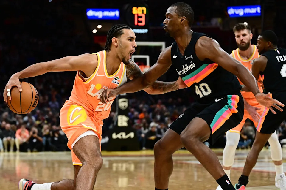 Cavaliers guard Jaylon Tyson drives to the basket against San Antonio Spurs forward Harrison Barnes on Dec. 5, 2025, in Cleveland.
