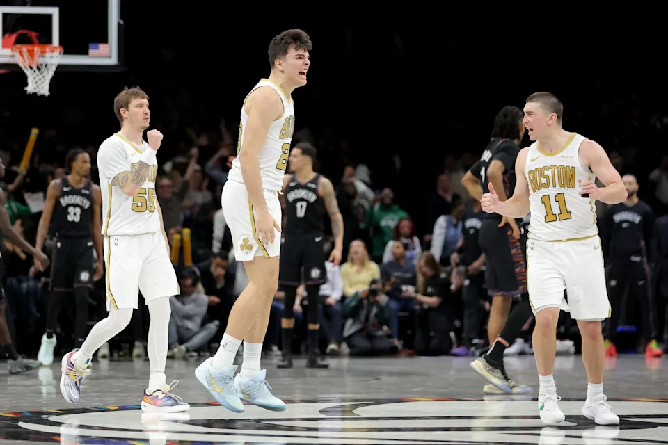 Jan 23, 2026; Brooklyn, New York, USA; Boston Celtics guard Hugo Gonzalez (28) celebrates his three point shot against the Brooklyn Nets with guards Baylor Scheierman (55) and Payton Pritchard (11) during the first overtime at Barclays Center. Mandatory Credit: Brad Penner-Imagn Images
