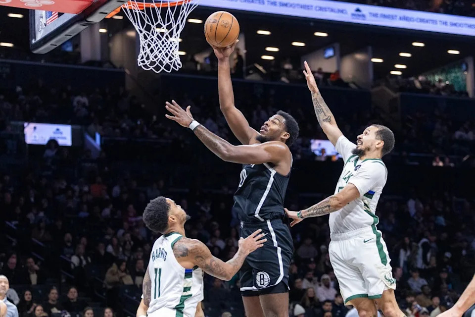 Day’Ron Sharpe goes up for a shot between defenders during the Ntes’ blowout win over the Bucks on Dec. 14, 2025 at Barclays Center. Corey Sipkin for the NY POST