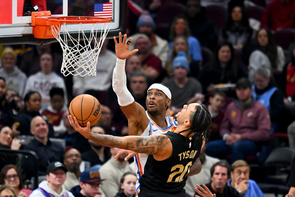 CLEVELAND, OHIO - JANUARY 19: Guard Jaylon Tyson #20 of the Cleveland Cavaliers shoots over guard Shai Gilgeous-Alexander #2 of the Oklahoma City Thunder during the second quarter at Rocket Arena on January 19, 2026 in Cleveland, Ohio. NOTE TO USER: User expressly acknowledges and agrees that, by downloading and or using this photograph, User is consenting to the terms and conditions of the Getty Images License Agreement. (Photo by Jason Miller/Getty Images)