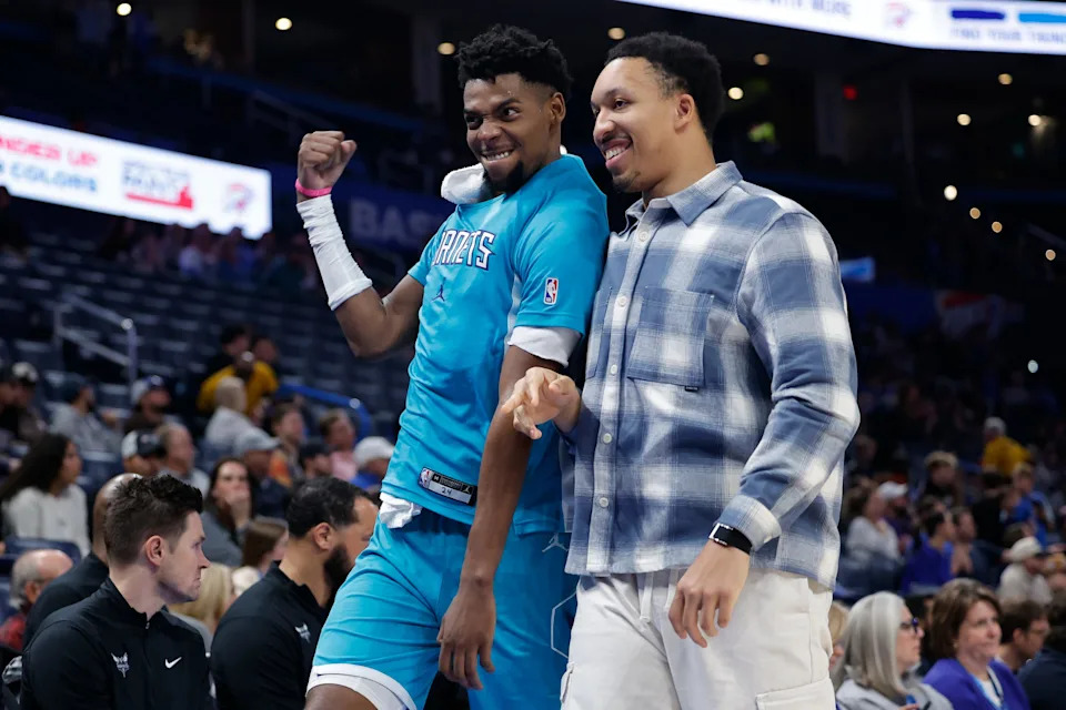 Jan 5, 2026; Oklahoma City, Oklahoma, USA; Charlotte Hornets forward Brandon Miller (24) and Charlotte Hornets forward Grant Williams (2) celebrate in the final seconds of a game against the Oklahoma City Thunder at Paycom Center. Mandatory Credit: Alonzo Adams-Imagn Images