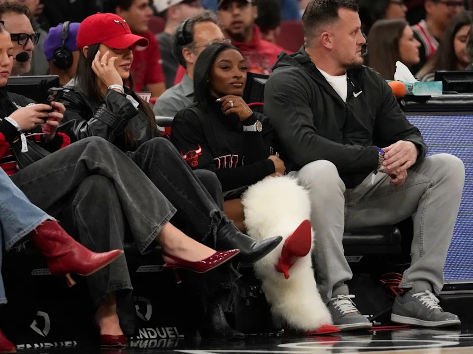 The gymnast watched the Bulls face off against the Utah Jazz. AP