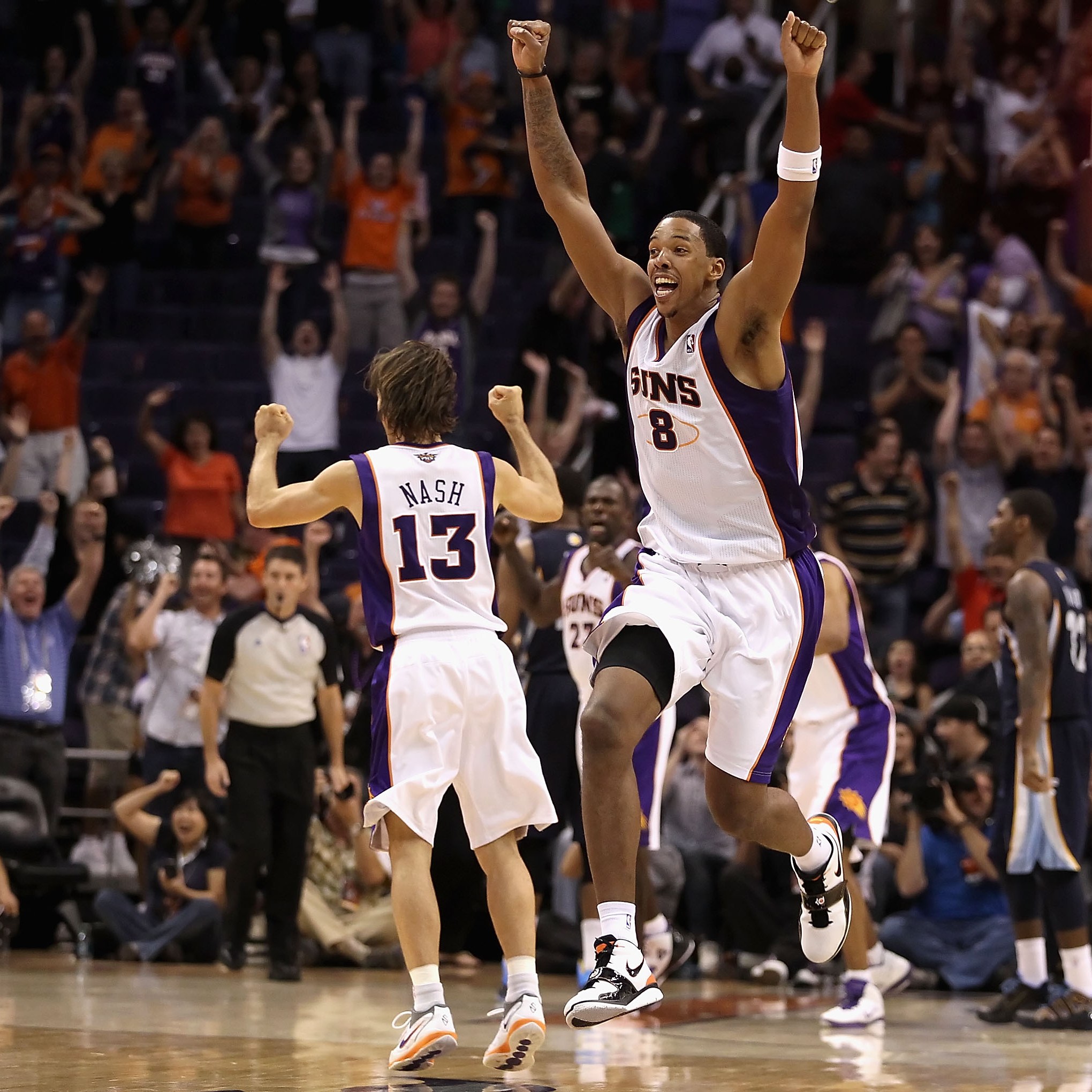PHOENIX - NOVEMBER 05: Channing Frye #8 of the Phoenix Suns celebrates after Jason Richardson , tied the game in the final seconds to force overtime against the Memphis Grizzlies during the NBA game at US Airways Center on November 5, 2010 in Phoenix, Arizona. The Suns defeated the Grizzlies 123-118 in double overtime. NOTE TO USER: User expressly acknowledges and agrees that, by downloading and or using this photograph, User is consenting to the terms and conditions of the Getty Images License Agreement. (Photo by Christian Petersen/Getty Images)