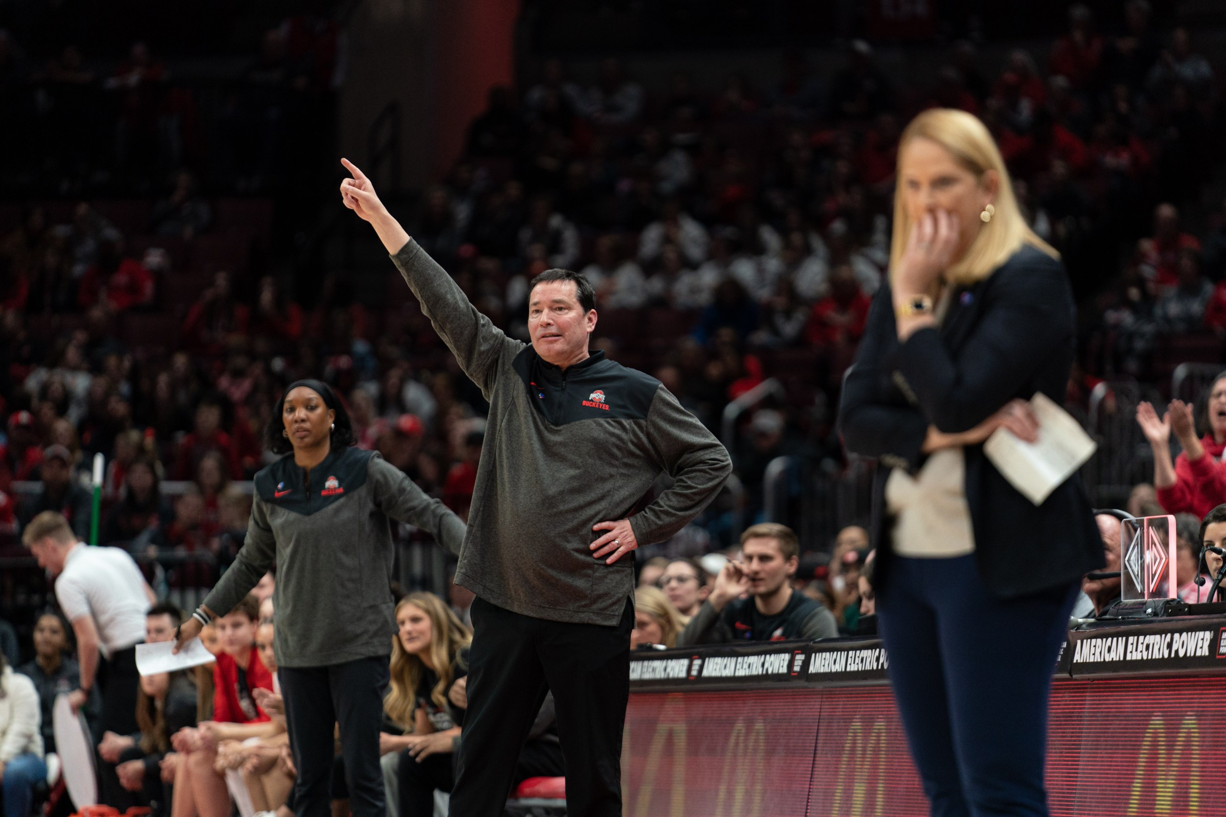 COLUMBUS, OH - FEBRUARY 24: Ohio State Buckeyes head coach Kevin McGuff signals to his team while Maryland Terrapins head coach Brenda Frese looks on during the college basketball game between the Ohio State Buckeyes and the Maryland Terrapins on February 24, 2023, at Value City Arena in Columbus, OH. (Photo by Ben Hsu/Icon Sportswire via Getty Images)