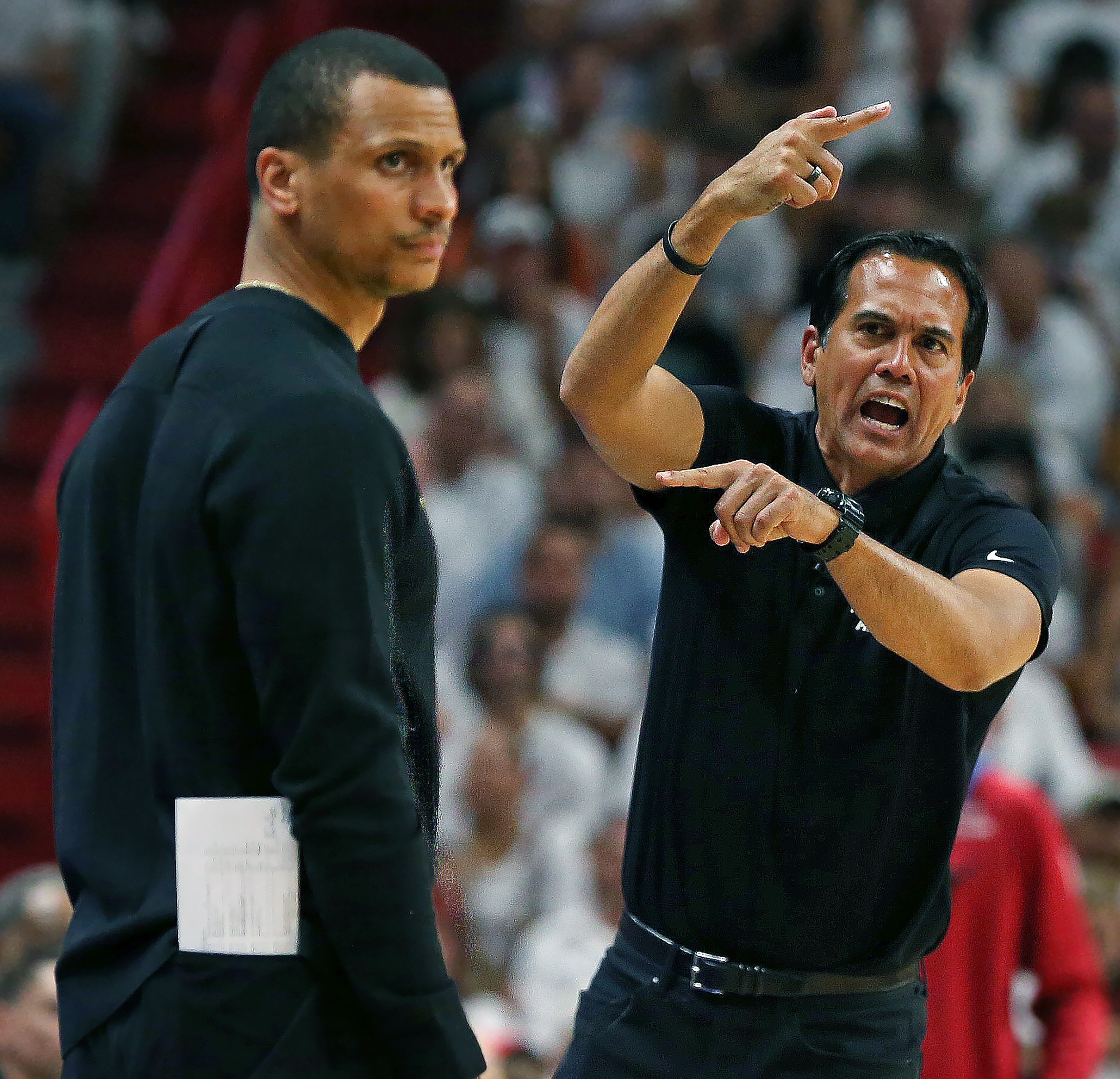 Miami, FL - May 21: Miami Heat head coach Erik Spoelstra screams at a referee while Boston Celtics head coach Joe Mazzulla looks away. The Celtics lost to the Heat, 128-102, in Game 3 of the 2023 Eastern Conference Finals. (Photo by Jim Davis/The Boston Globe via Getty Images)