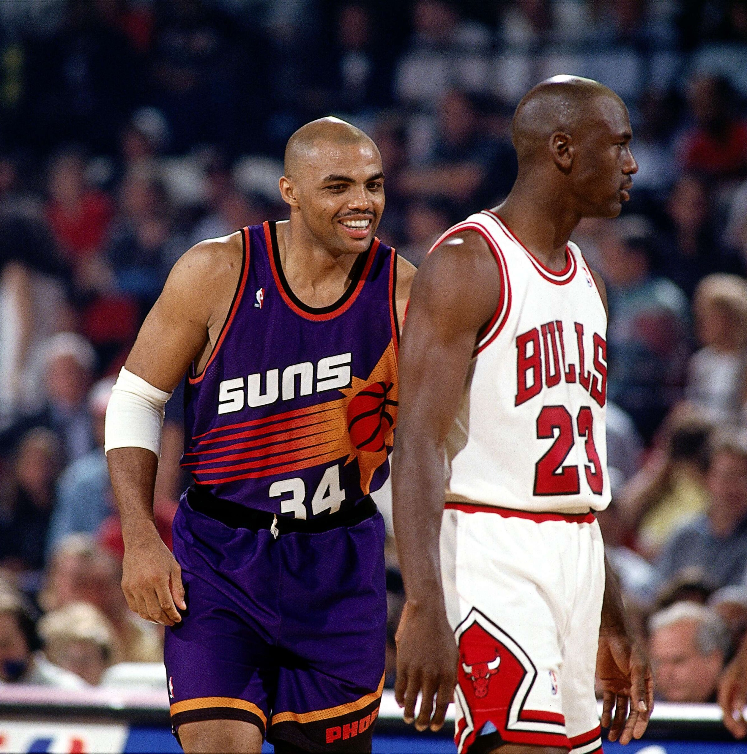 CHICAGO - JUNE 13: Charles Barkley #34 of the Phoenix Suns and Michael Jordan #23 of the Chicago Bulls during Game Three of the 1993 NBA Championsip Finals at Chicago Stadium on June 13, 1993 in Chicago, Illinois. The Suns won 129-121 in triple overtime, making the Series 1-2 in favor of the Bulls. NOTE TO USER: User expressly acknowledges and agrees that, by downloading and/or using this Photograph, User is consenting to the terms and conditions of the Getty Images License Agreement. Mandatory copyright notice: Copyright 1993 NBAE. (Photo by Nathaniel S. Butler/NBAE via Getty Images)
