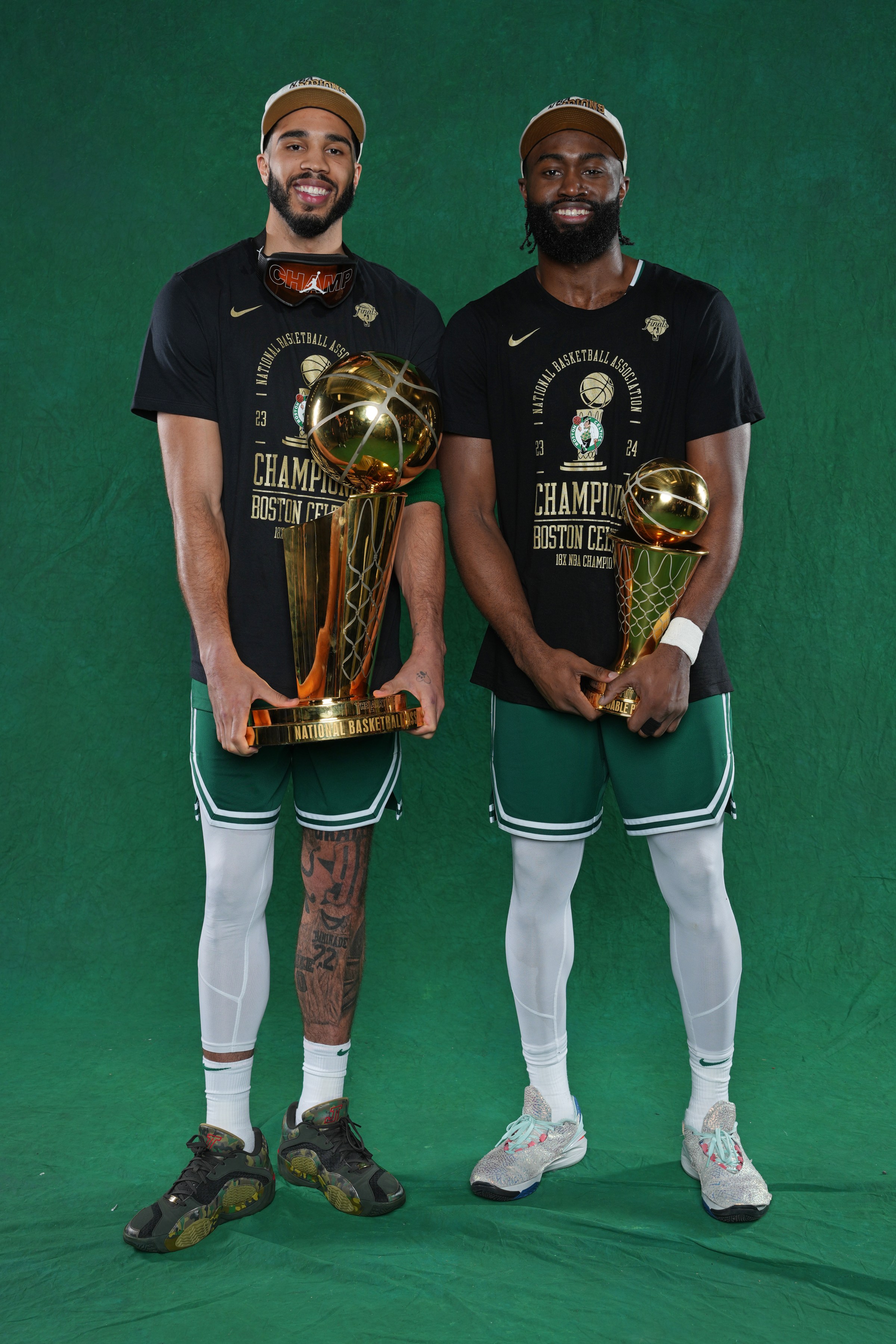 BOSTON, MA - JUNE 17: Jayson Tatum #0 and Jaylen Brown #7 of the Boston Celtics pose for a portrait with the Larry O’Brian Trophy and with the The Bill Russell Finals MVP Trophy after winning Game 5 of the 2024 NBA Finals on June 17, 2024 at the TD Garden in Boston, Massachusetts. NOTE TO USER: User expressly acknowledges and agrees that, by downloading and or using this photograph, User is consenting to the terms and conditions of the Getty Images License Agreement. Mandatory Copyright Notice: Copyright 2024 NBAE (Photo by Jesse D. Garrabrant/NBAE via Getty Images)