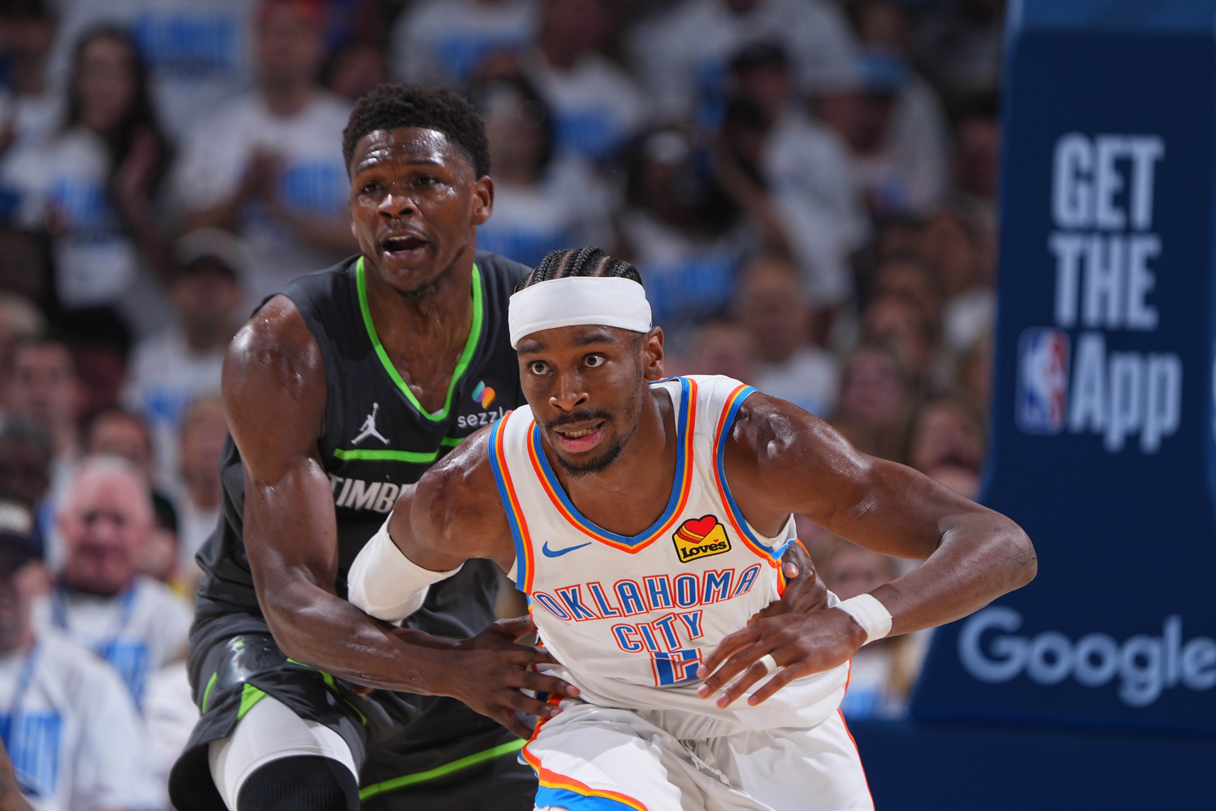 OKLAHOMA CITY, OK - MAY 20: Anthony Edwards #5 of the Minnesota Timberwolves and Shai Gilgeous-Alexander #2 of the Oklahoma City Thunder look on during the game during Game One of the Western Conference Finals on May 20, 2025 at Paycom Center in Oklahoma City, Oklahoma. NOTE TO USER: User expressly acknowledges and agrees that, by downloading and or using this photograph, User is consenting to the terms and conditions of the Getty Images License Agreement. Mandatory Copyright Notice: Copyright 2025 NBAE (Photo by Garrett Ellwood/NBAE via Getty Images)