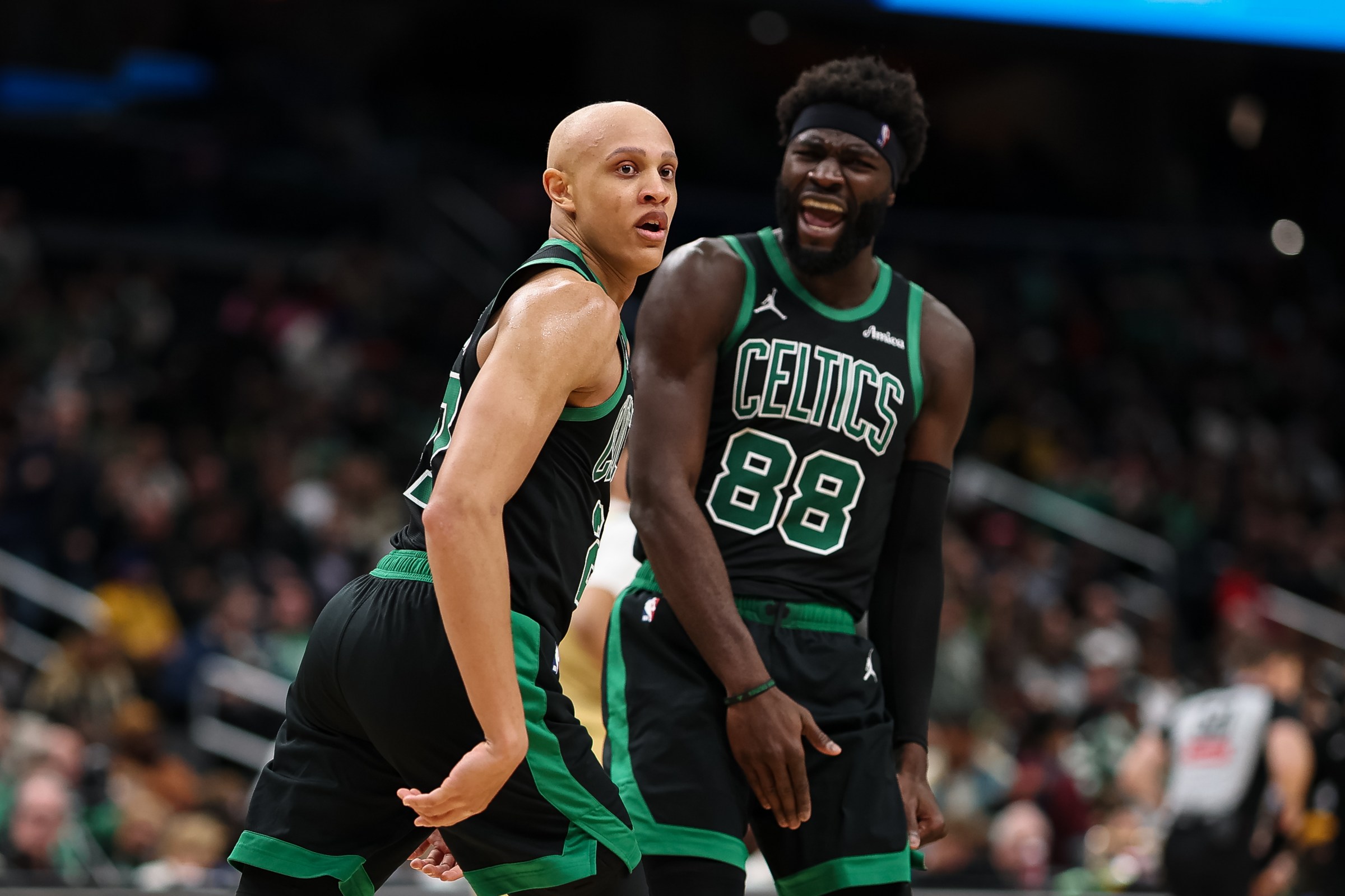 WASHINGTON, DC - DECEMBER 04: Neemias Queta #88 of the Boston Celtics celebrates with Jordan Walsh #27 after a play against the Washington Wizards during the second half at Capital One Arena on December 4, 2025 in Washington, DC. NOTE TO USER: User expressly acknowledges and agrees that, by downloading and or using this photograph, User is consenting to the terms and conditions of the Getty Images License Agreement. (Photo by Scott Taetsch/Getty Images)