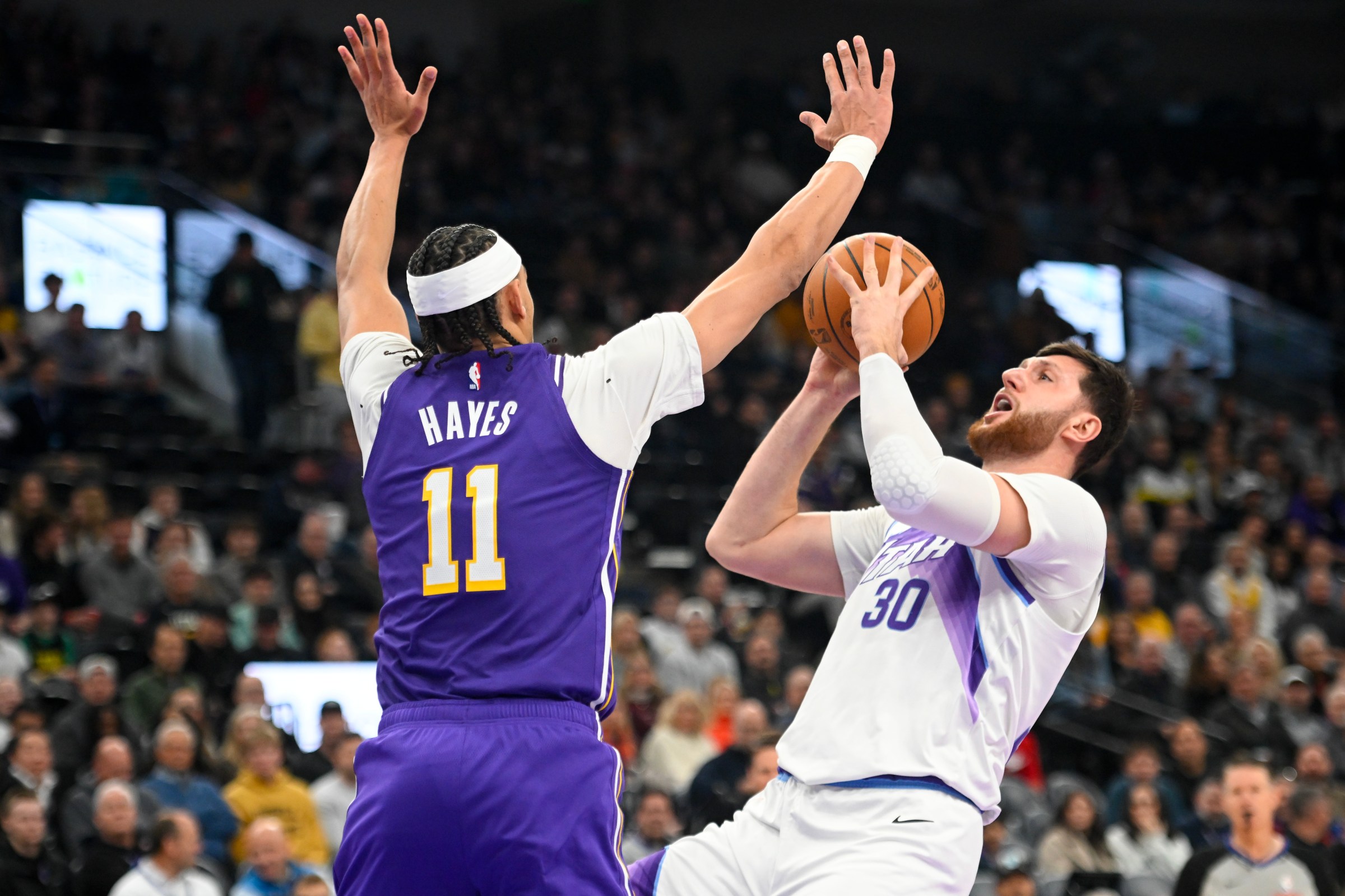 SALT LAKE CITY, UTAH - DECEMBER 18: Jusuf Nurkic #30 of the Utah Jazz shoots over Jaxson Hayes #11 of the Los Angeles Lakers during the first half of a game at Delta Center on December 18, 2025 in Salt Lake City, Utah. NOTE TO USER: User expressly acknowledges and agrees that, by downloading and or using this photograph, User is consenting to the terms and conditions of the Getty Images License Agreement. (Photo by Alex Goodlett/Getty Images)