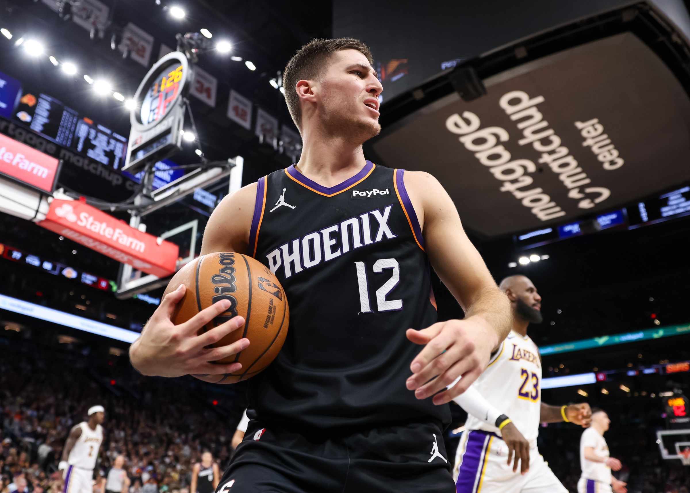 PHOENIX, ARIZONA - DECEMBER 14: Collin Gillespie #12 of the Phoenix Suns on court during the second half of a game against the Los Angeles Lakers at Mortgage Matchup Center on December 14, 2025 in Phoenix, Arizona. NOTE TO USER: User expressly acknowledges and agrees that, by downloading and or using this photograph, User is consenting to the terms and conditions of the Getty Images License Agreement. (Photo by Mike Christy/Getty Images)