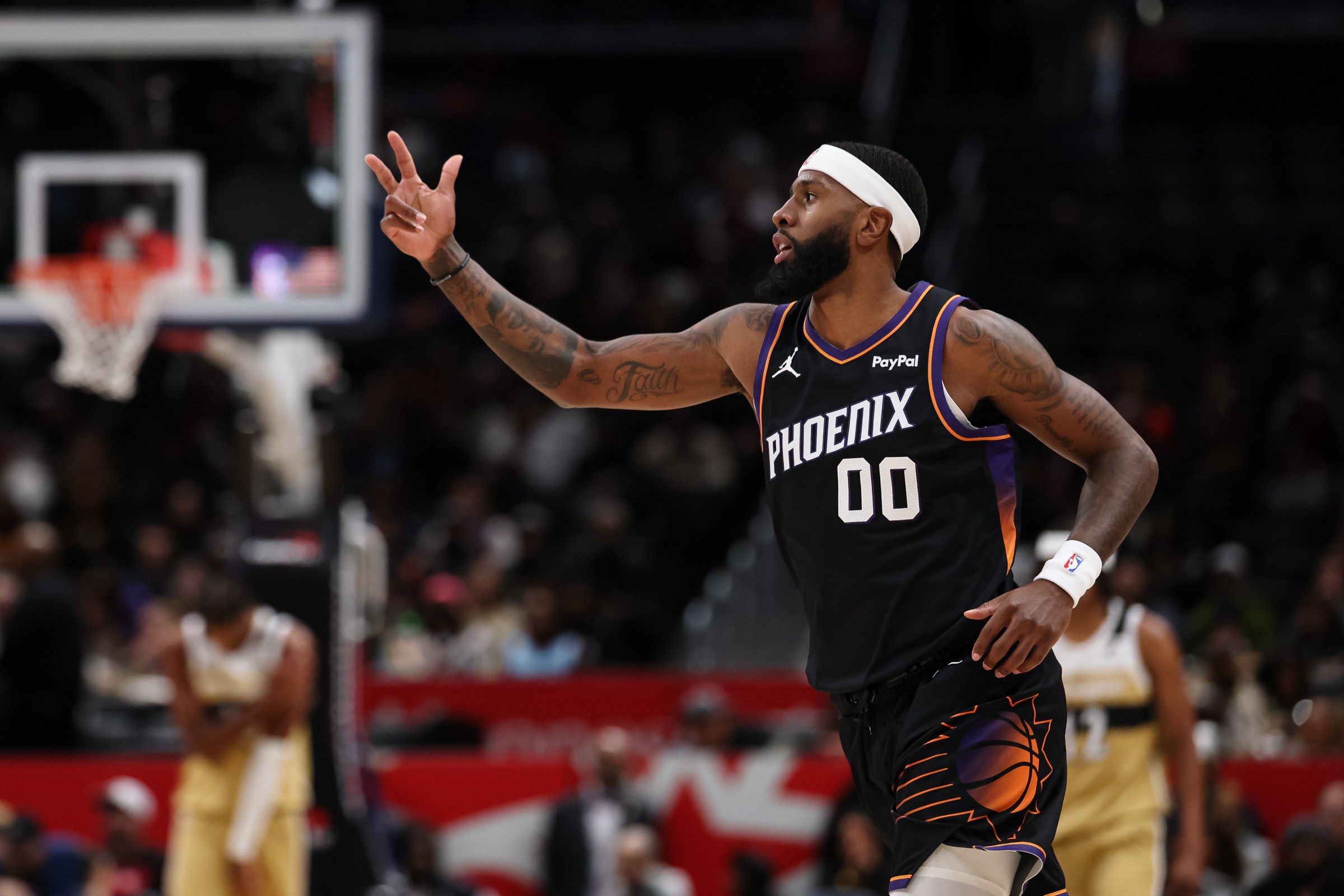 WASHINGTON, DC - DECEMBER 29: Royce O’Neale #00 of the Phoenix Suns celebrates after making a three-point basket against the Washington Wizards during the first half at Capital One Arena on December 29, 2025 in Washington, DC. NOTE TO USER: User expressly acknowledges and agrees that, by downloading and or using this photograph, User is consenting to the terms and conditions of the Getty Images License Agreement. (Photo by Scott Taetsch/Getty Images)