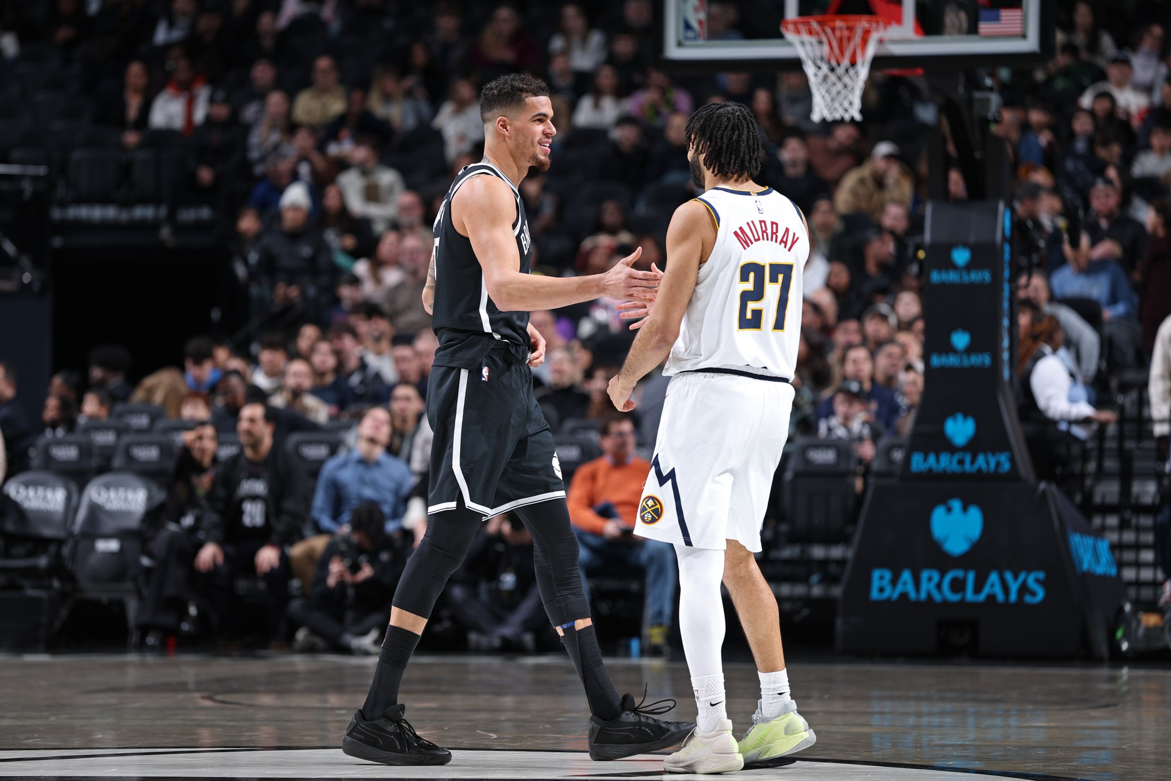 NEW YORK, NY - JANUARY 4: Michael Porter Jr. #17 of the Brooklyn Nets high fives Jamal Murray #27 of the Denver Nuggets before the game on January 4, 2026 at Barclays Center in New York City, New York. NOTE TO USER: User expressly acknowledges and agrees that, by downloading and or using this photograph, User is consenting to the terms and conditions of the Getty Images License Agreement. Mandatory Copyright Notice: Copyright 2025 NBAE (Photo by David L. Nemec/NBAE via Getty Images)