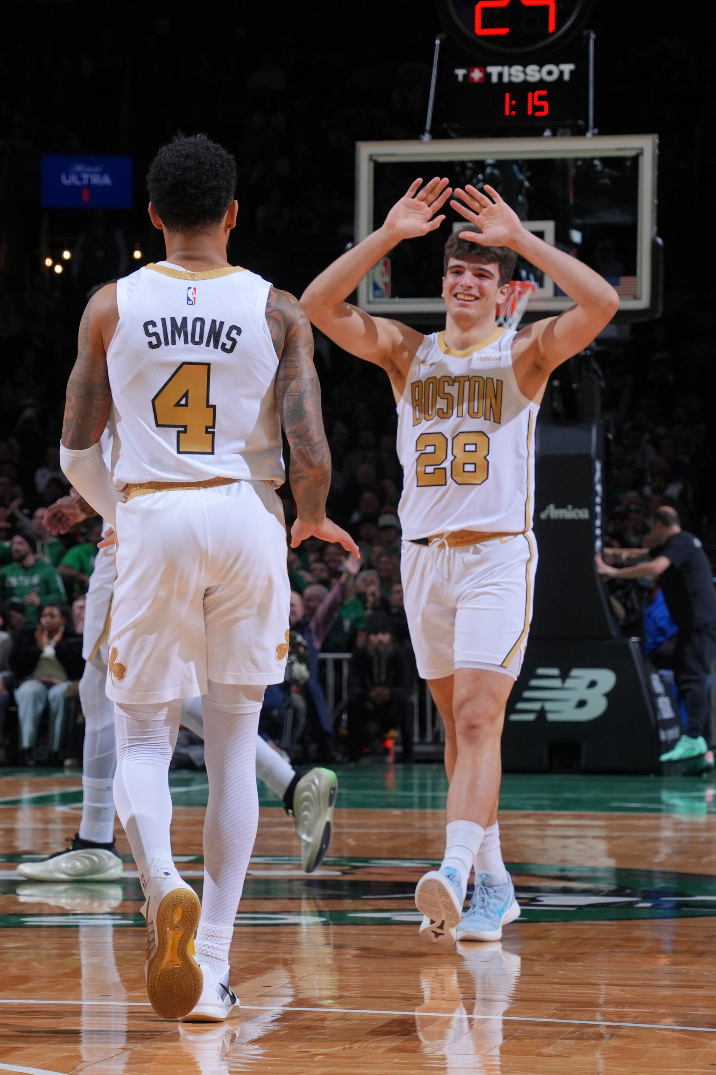BOSTON, MA - JANUARY 5: Anfernee Simons #4 and Hugo Gonzalez #28 of the Boston Celtics high five during the game against the Chicago Bulls on January 5, 2026 at TD Garden in Boston, Massachusetts. NOTE TO USER: User expressly acknowledges and agrees that, by downloading and/or using this Photograph, user is consenting to the terms and conditions of the Getty Images License Agreement. Mandatory Copyright Notice: Copyright 2026 NBAE (Photo by Brian Babineau/NBAE via Getty Images)