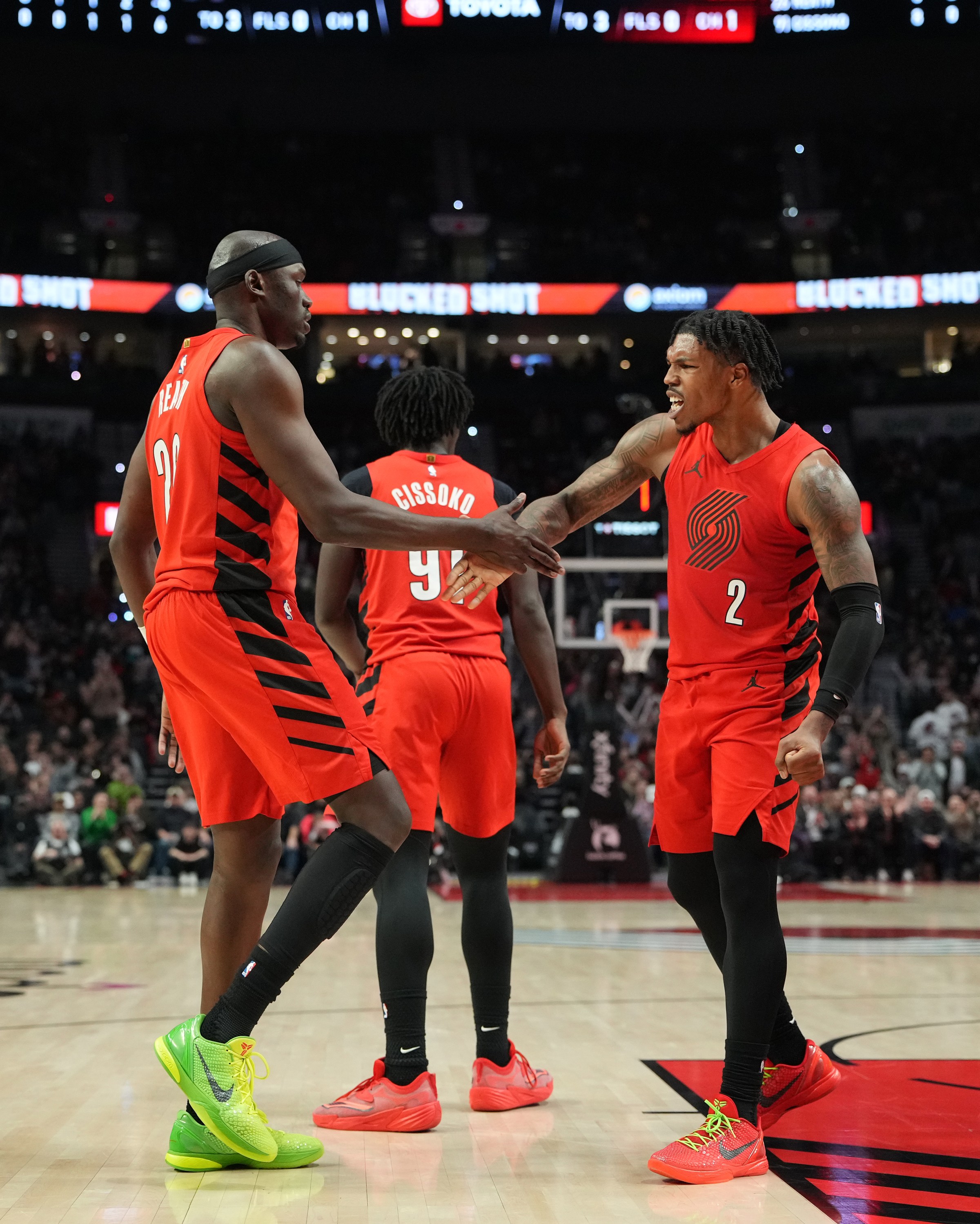 PORTLAND, OR - JANUARY 9: Duop Reath #26 and Caleb Love #2 of the Portland Trail Blazers high five during the game against the Houston Rockets on January 9, 2026 at the Moda Center Arena in Portland, Oregon. NOTE TO USER: User expressly acknowledges and agrees that, by downloading and or using this photograph, user is consenting to the terms and conditions of the Getty Images License Agreement. Mandatory Copyright Notice: Copyright 2026 NBAE (Photo by Soobum Im/NBAE via Getty Images)