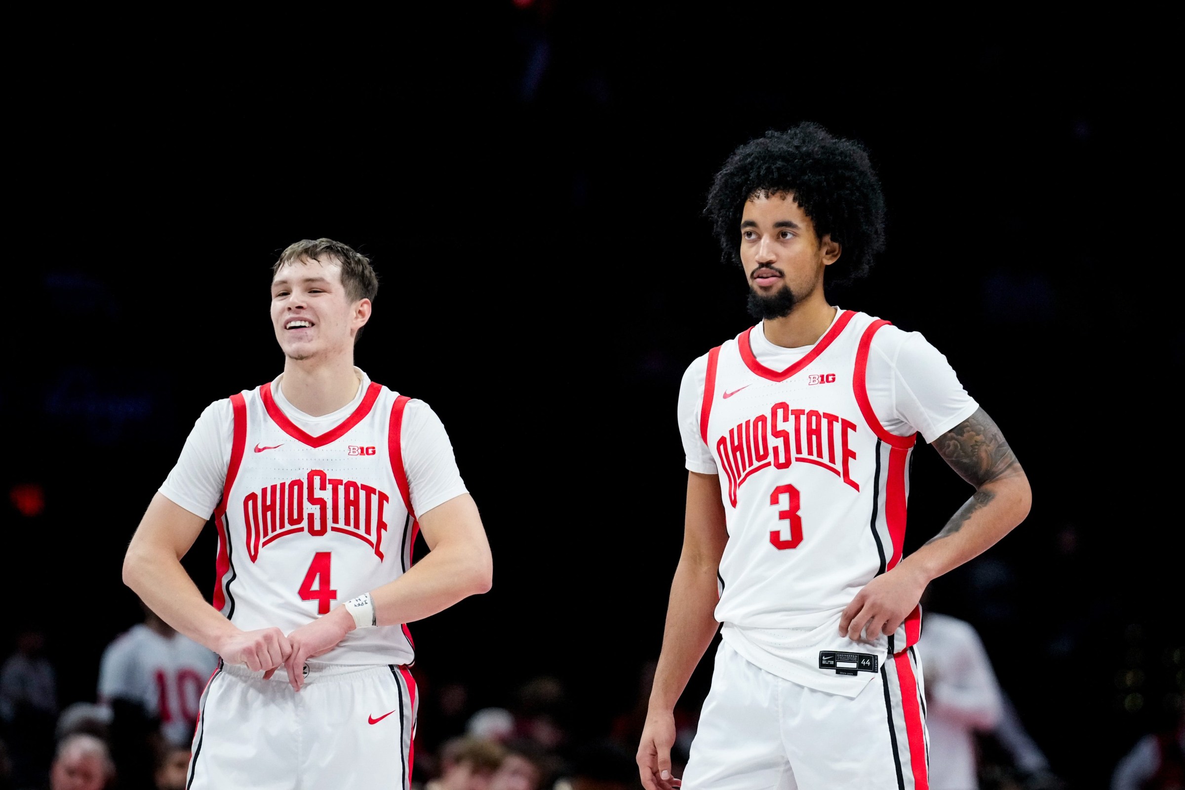 Ohio State Buckeyes guard Gabe Cupps (4) and guard Taison Chatman (3) watch their teammate shoot a free throw in the second half of the NCAA basketball game at Value City Arena on Thursday, Nov. 20, 2025 in Columbus, Ohio.