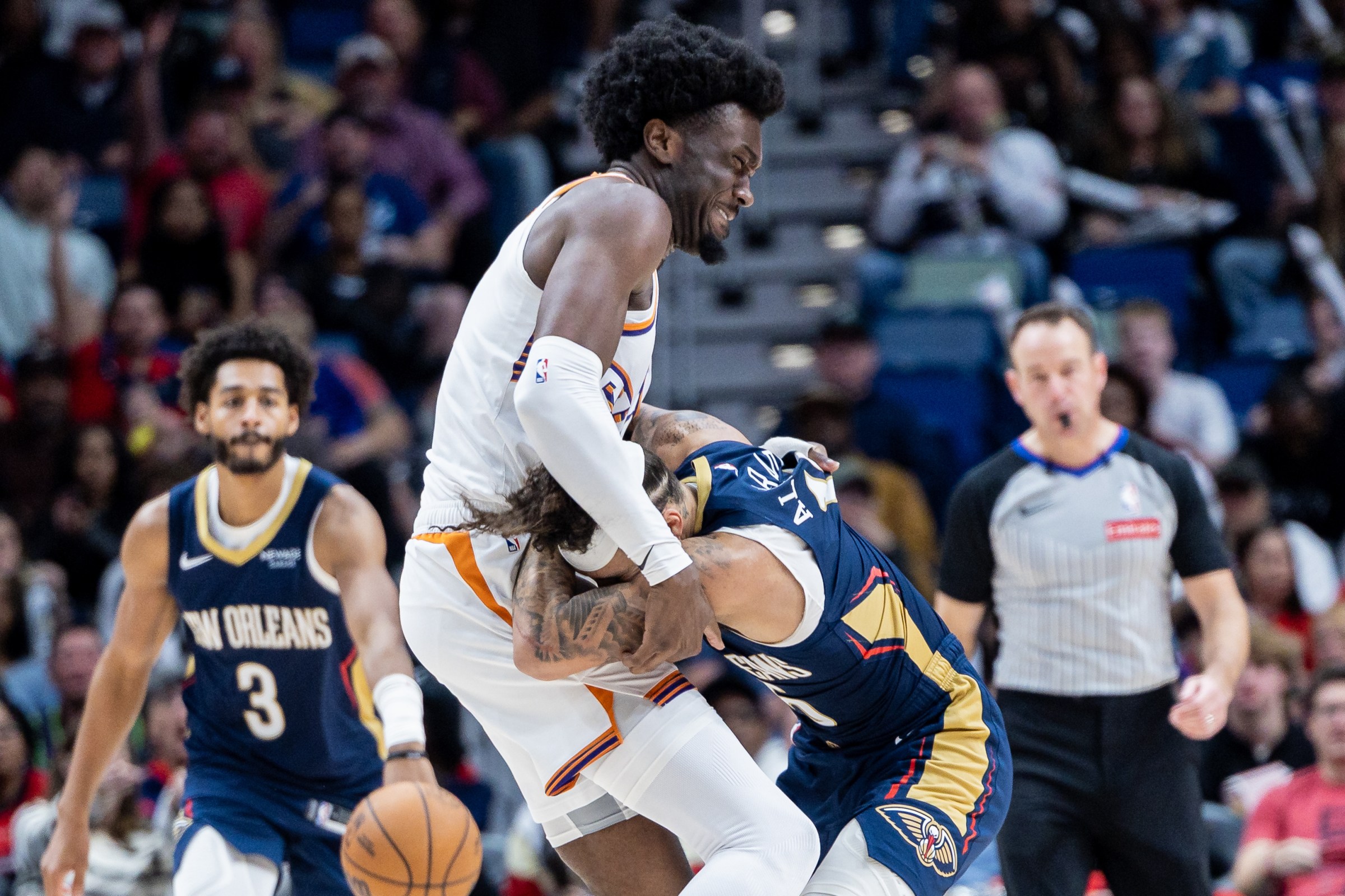 Dec 27, 2025; New Orleans, Louisiana, USA; New Orleans Pelicans guard Jose Alvarado (15) gets into a scrum with Phoenix Suns center Mark Williams (15) over a play during the second half at Smoothie King Center. Mandatory Credit: Stephen Lew-Imagn Images