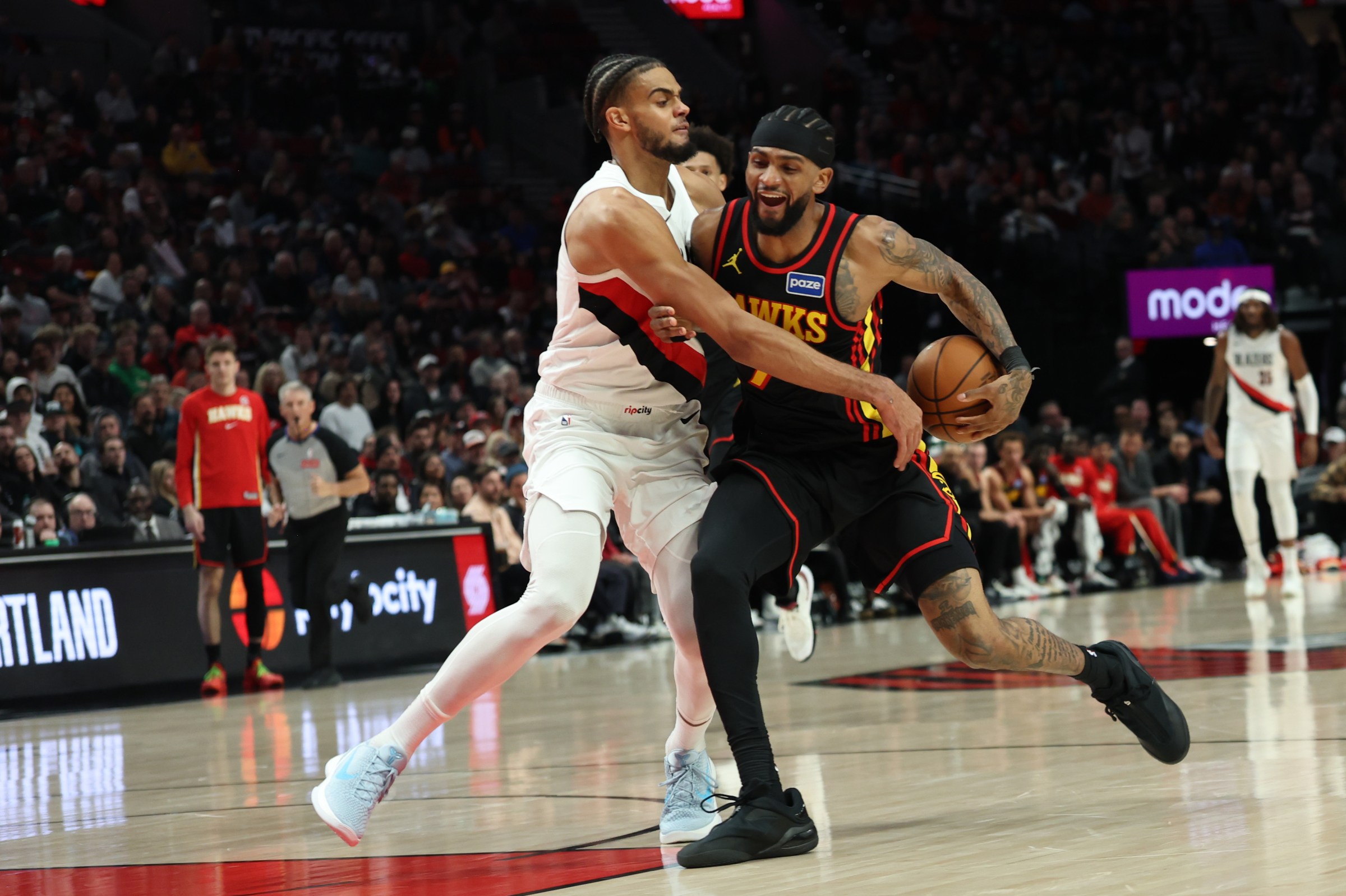 Jan 15, 2026; Portland, Oregon, USA; Portland Trail Blazers guard/forward Rayan Rupert (21) strips the ball away from Atlanta Hawks guard Nickel Alexander-Walker (7) battle for a loose ball during the second half at Moda Center. Mandatory Credit: Jaime Valdez-Imagn Images