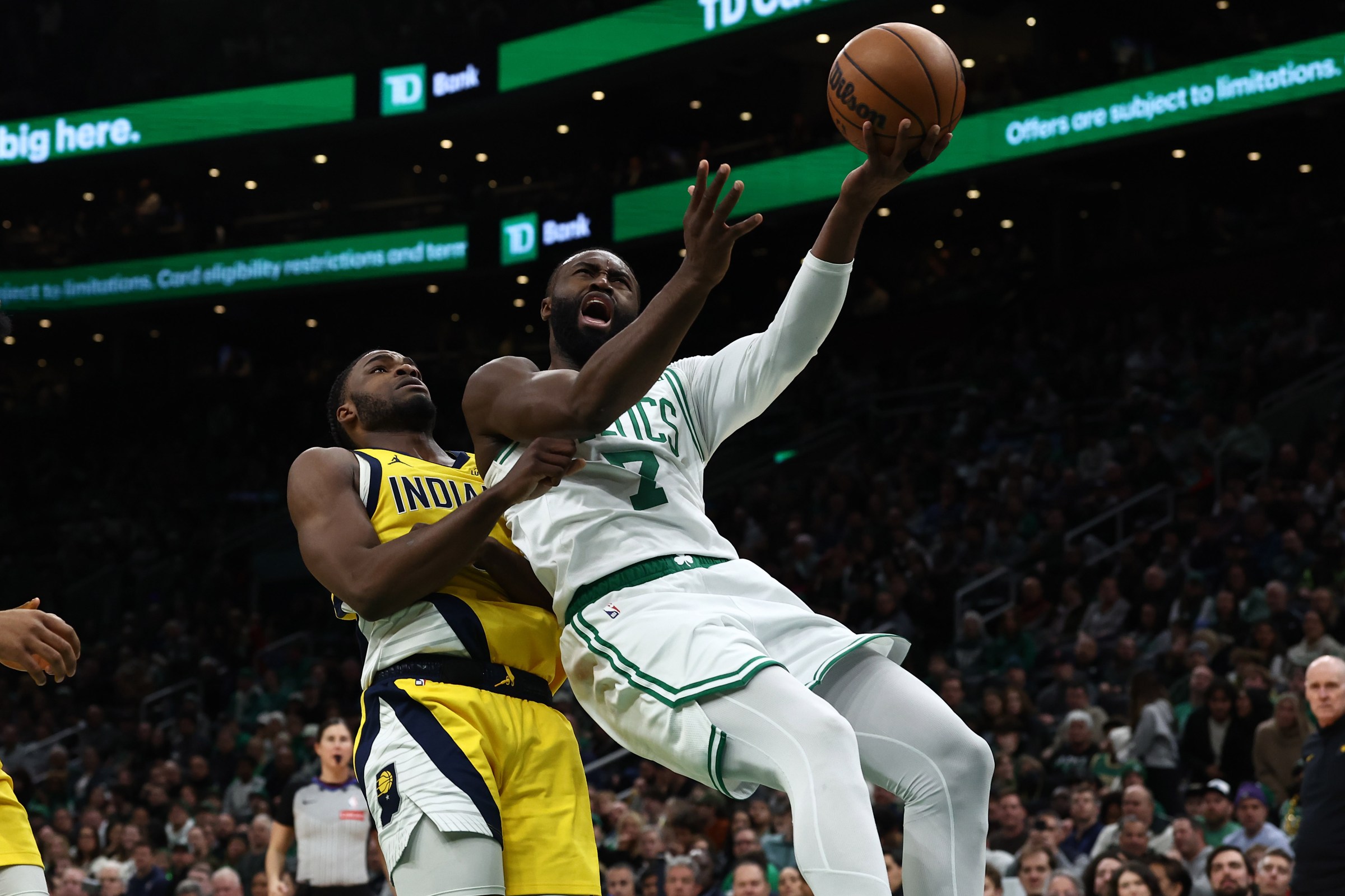 Jan 21, 2026; Boston, Massachusetts, USA; Boston Celtics guard Jaylen Brown (7) gets off a shot past Indiana Pacers guard Tyrese Haliburton (0) during the first quarter at TD Garden. Mandatory Credit: Winslow Townson-Imagn Images