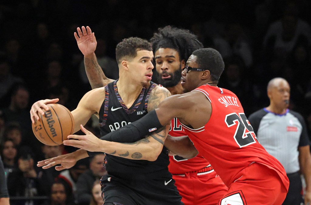 Jalen Smith #25 of the Chicago Bulls defends against Michael Porter Jr. #17 of the Brooklyn Nets as Porter Jr. looks for the open man during the second quarter.