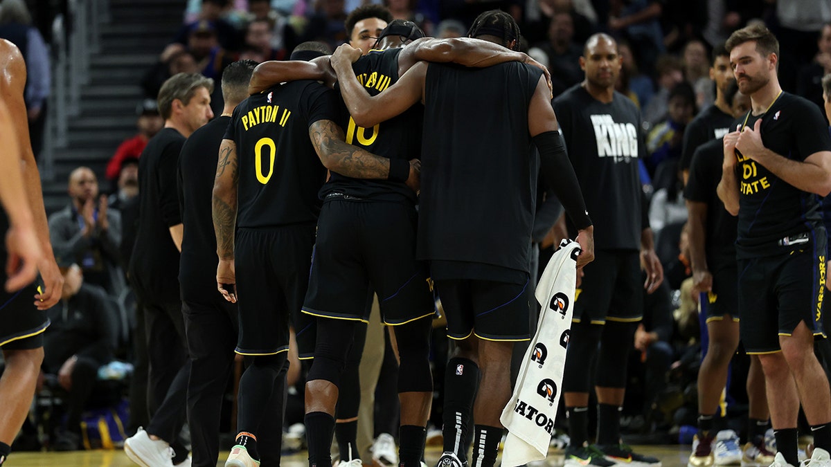Jimmy Butler helped off court