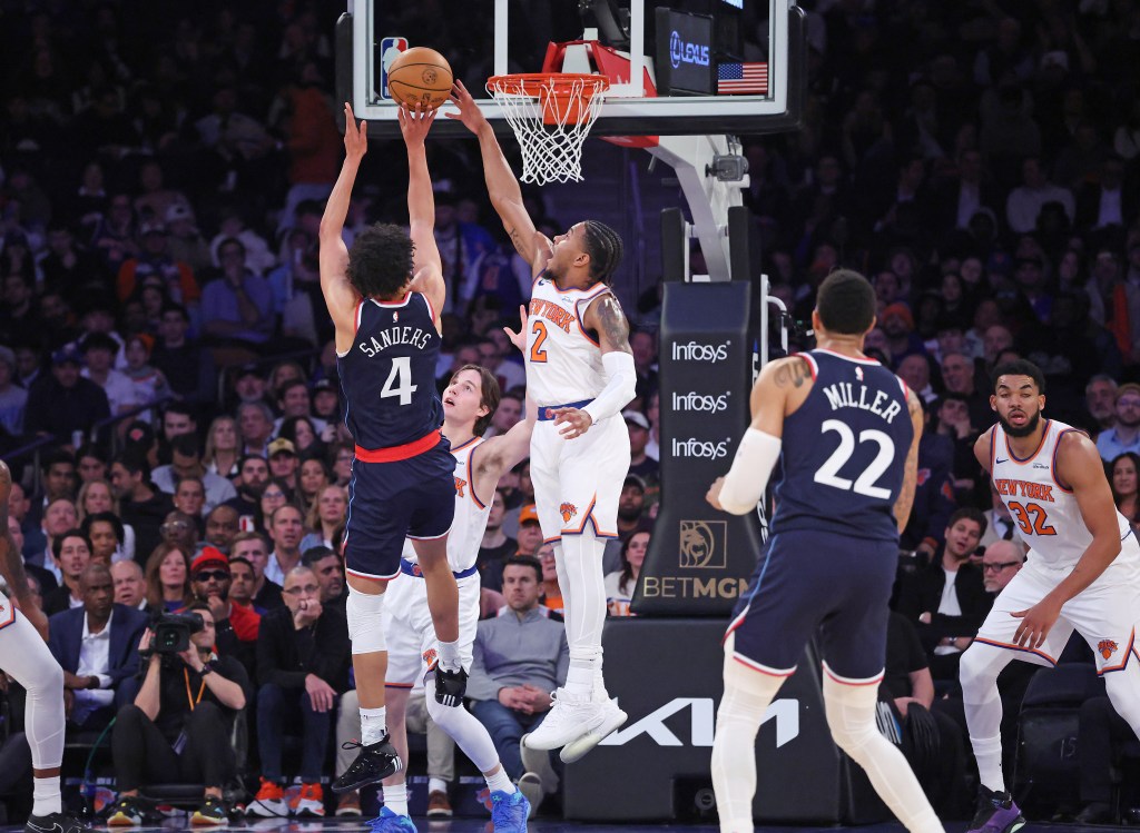 New York Knicks guard Miles McBride #2 blocks a shot by LA Clippers guard Kobe Sanders #4 during the second quarter.