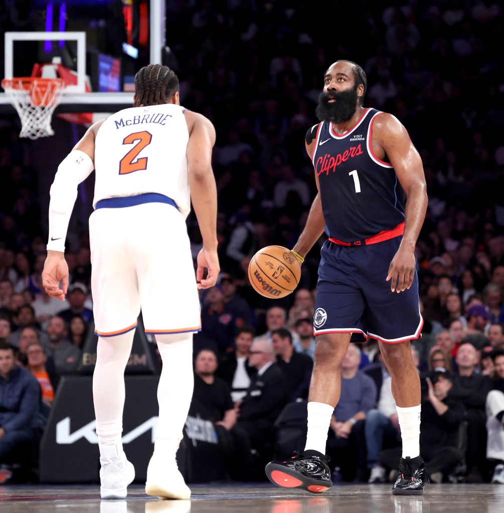 LA Clippers guard James Harden #1 looks for an opening as New York Knicks guard Miles McBride #2 defends during the third quarter.